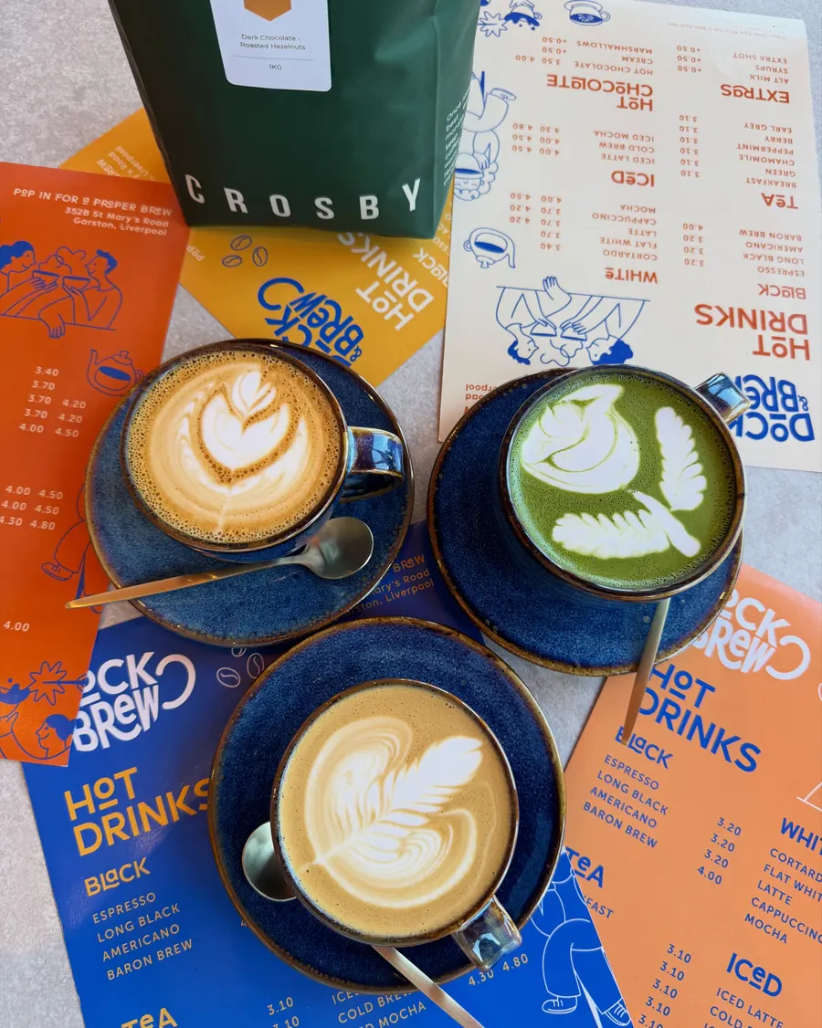 Three coffees with latte art on the Dock & Brew menu